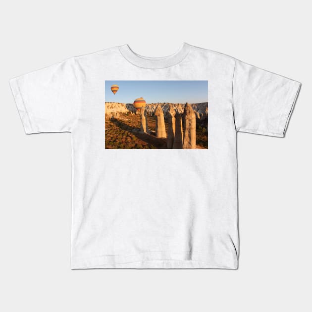 Sunshine Kisses The Balloons, Goreme, Turkey Kids T-Shirt by Carole-Anne